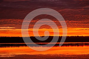 Beautiful sky background with clouds after sunset. Red yellow sky.