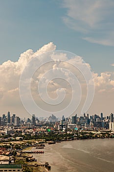 Beautiful sky and cloud view of Bangkok with skyscrapers along Chaopraya river in the afternoon