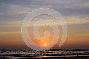 Beautiful sky colorful sunset on the ocean, natural landscapes. Deserted beach, the sun sets in the clouds above the sea