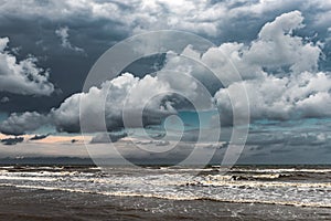 Beautiful sky with dense clouds over the stormy sea