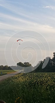 Beautiful sky. With hang gliders fluffy clouds trees