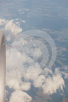 Beautiful sky and jet engine view outside the window of commercial airplane while floating on the atmosphere sky to