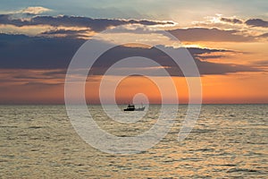 Beautiful sky during sunset over fishing boat