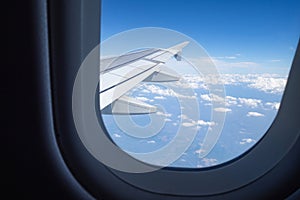 Beautiful skyline and clouds from looking out at windows on the airplane. Feeling freedom with nature scenic blue sky and help