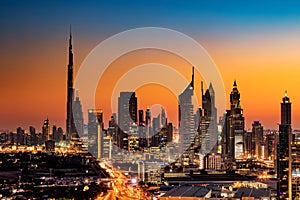 A beautiful Skyline view of Dubai, UAE as seen from Dubai Frame at sunset photo