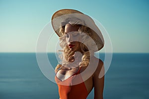 Beautiful slender blonde at the sea. Summer travel photos