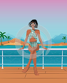 Beautiful slender girl in a swimsuit and glasses posing against the backdrop of a seascape while riding a yacht on vacation
