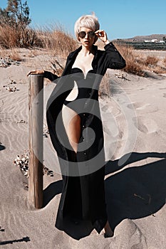 Beautiful slender woman in black tunic