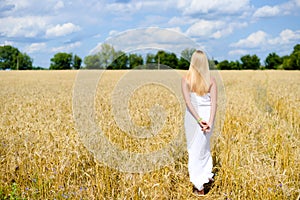 Beautiful slim sexi blond lady in white long dress