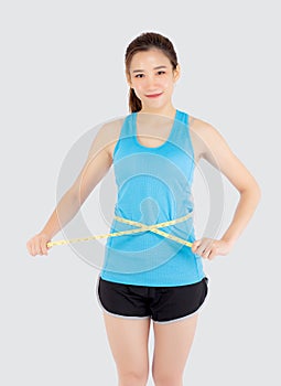 Beautiful slim young asian woman measuring tape thin waist wear uniform fitness isolated white background