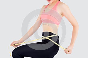 Beautiful slim young asian woman measuring tape thin waist wear uniform fitness isolated white background