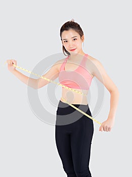 Beautiful slim young asian woman measuring tape thin waist wear uniform fitness isolated white background