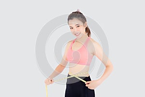 Beautiful slim young asian woman measuring tape thin waist wear uniform fitness isolated white background