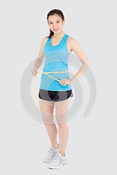 Beautiful slim young asian woman measuring tape thin waist wear uniform fitness isolated white background