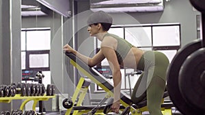 Beautiful Slim Young Female Fitness Model Training Exercise For Back Muscles