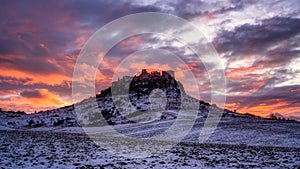 Old Spis Zipser Castle above valley at sunset