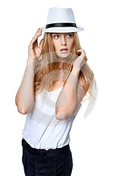 Beautiful slytish woman posing in fedora hat