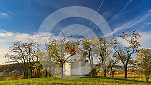 Beautiful small chapel with trees and autumn landscape. Moravske Kninice - Chapel of st. Cyril and Methodius