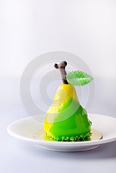 Beautiful Small Mousse Cake in Shape of Pear Tasty Modern Dessert Pastry White Blue Background Vertical