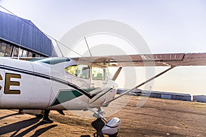 A beautiful small plane waiting to lift off in a private airport