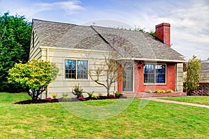 Beautiful small siding house with a brick trim wall