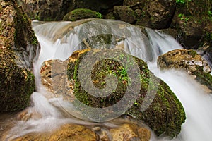 Beautiful small waterfall landscape in the mountains.