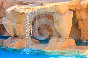 Beautiful small waterfall in swimming pool