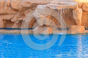 Beautiful small waterfall in swimming pool