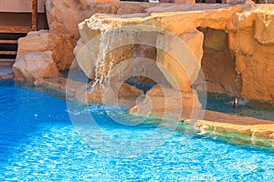 Beautiful small waterfall in swimming pool