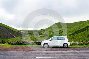 Beautiful Small white car standing by the road side