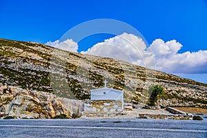 Beautiful littlewhite church on top of the hill in Greece