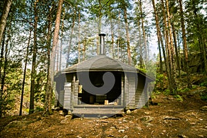 A beautiful small wooden building in the middle of Finnish forest