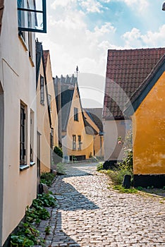 Beautiful, small, yellow rustic houses. Traditional Scandinavian style.
