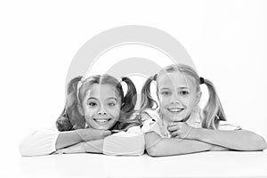 Beautiful and smart. School girls in pigtails. Cute little girls smiling isolated on white. Happy small girls at school