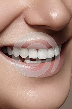 Beautiful smile with whitening teeth. Dental photo. Macro closeup of perfect female mouth, lipscare rutine