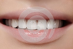 Beautiful smile with whitening teeth. Dental photo. Macro closeup of perfect female mouth, lipscare rutine