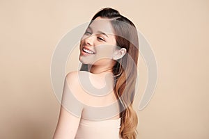 Beautiful smile of young asian woman with healthy white teeth on beige background, Dental care. Dentistry concept