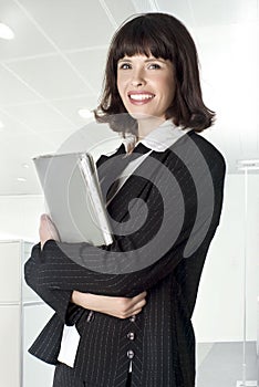 Beautiful smiley woman holding folder