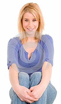 Beautiful Smiling Blonde Sitting Down and Relaxing