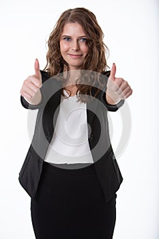 A beautiful smiling business woman gives both hands a thumbs- up sign that everything is OK