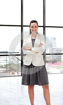 Beautiful smiling businesswoman with folded arms