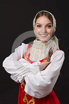 Beautiful smiling caucasian girl in russian folk costume