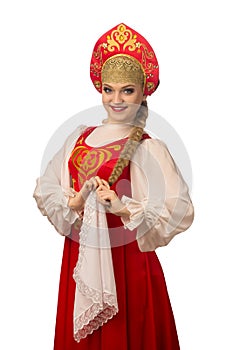 Beautiful smiling caucasian girl in russian folk costume on white