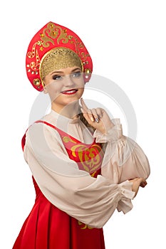 Beautiful smiling caucasian girl in russian folk costume on white