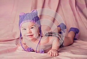 Beautiful smiling cute baby portrait lie on a stomach