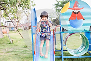 Beautiful smiling cute girl on a playground