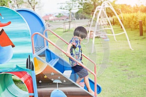 Beautiful smiling cute girl on a playground