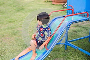 Beautiful smiling cute girl on a playground