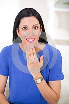 Beautiful smiling deaf woman using sign language
