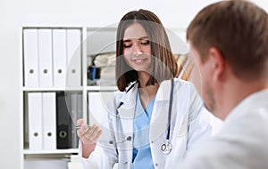 Beautiful smiling female doctor hold